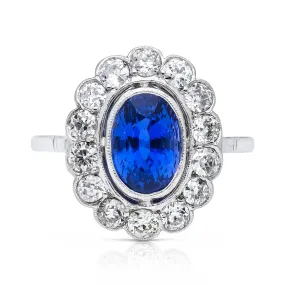 2.5ct oval blue sapphire and diamond cluster ring, 18ct white gold