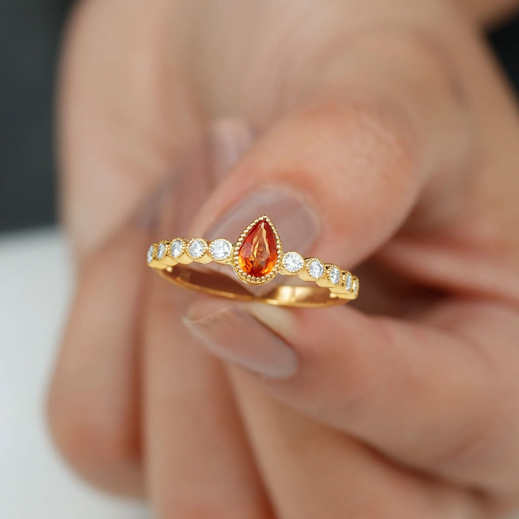 Beaded Bezel Set Pear Cut Orange Sapphire Ring with Diamond