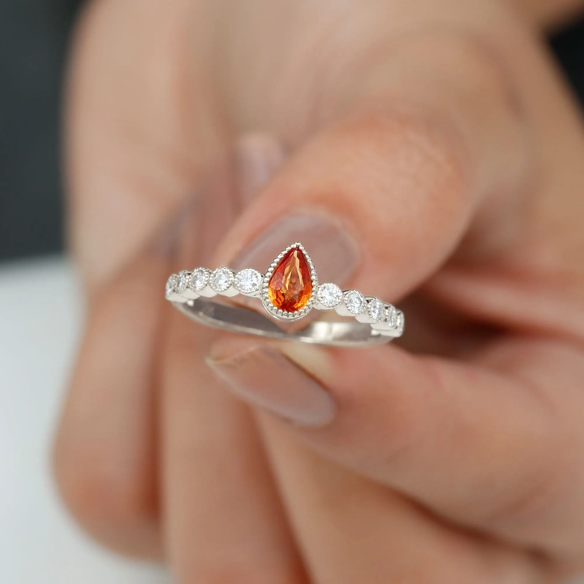 Beaded Bezel Set Pear Cut Orange Sapphire Ring with Diamond
