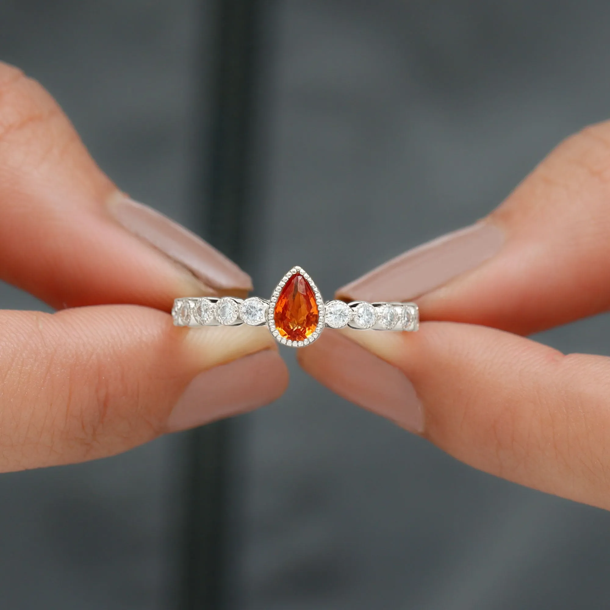 Beaded Bezel Set Pear Cut Orange Sapphire Ring with Diamond
