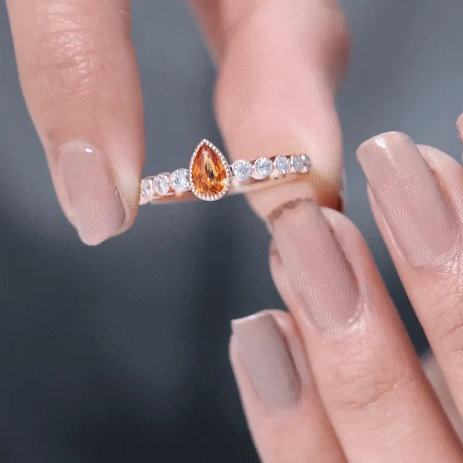 Beaded Bezel Set Pear Cut Orange Sapphire Ring with Diamond